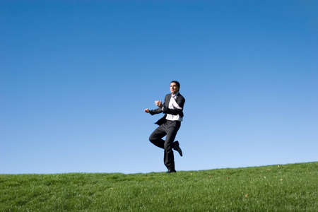 Businessman jumping in the airの写真素材