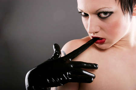 Sexy woman in leather glovesの写真素材