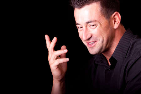 Handsome man in dark shirt laughing