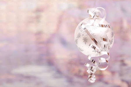 Silver Christmas ornaments with shiny ribbonの写真素材