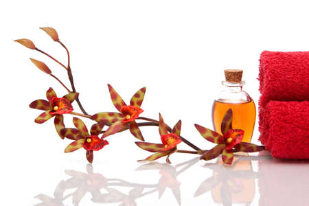 Essential oils, spa towels and orchidの写真素材
