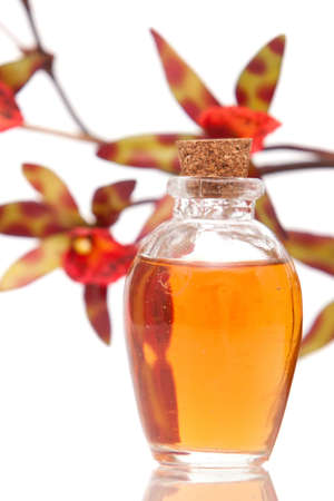 Essential oils and orchid on white backgroundの写真素材