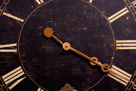 Antique looking dark color wall clockの写真素材