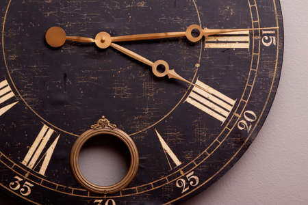 Antique looking dark color wall clockの写真素材