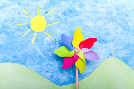 Colorful windmill toy on green environment conceptの写真素材