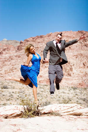 Attractive couple posing in fashionable dressesの写真素材