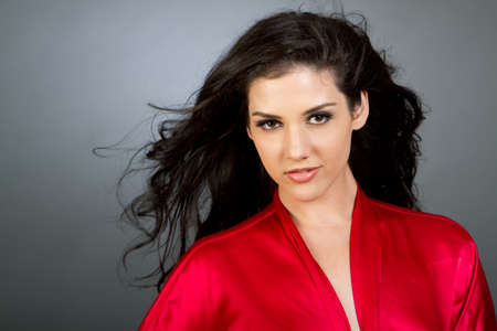 Gorgeous young multiracial woman with dark hair fashion shotの写真素材