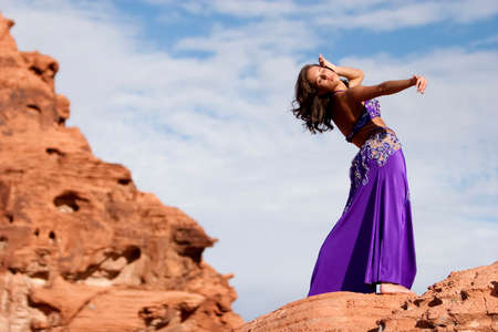 Beautiful sexy bellydancer in the desertの写真素材