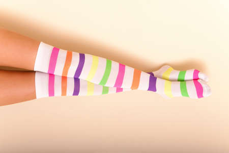 A woman wearing colorful long female socks