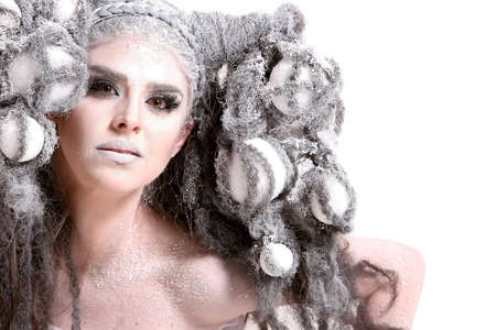 Gorgeous young woman wearing high fashion style makeup and hairdo