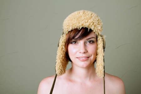 Pretty short haired woman in hatの写真素材