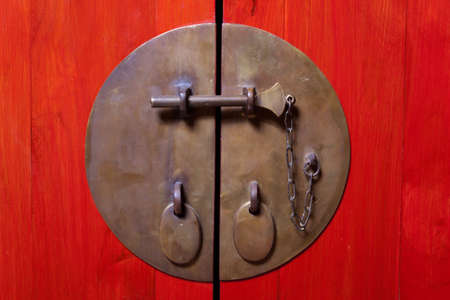 Door locked with antique looking locksの写真素材
