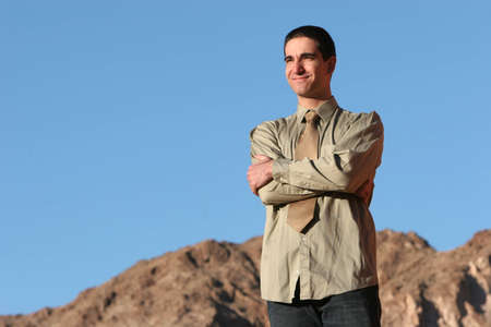 Young successful businessman posing outdoors