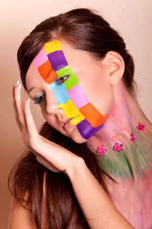 Young long hair brunette girl with colorful fashion makeupの写真素材