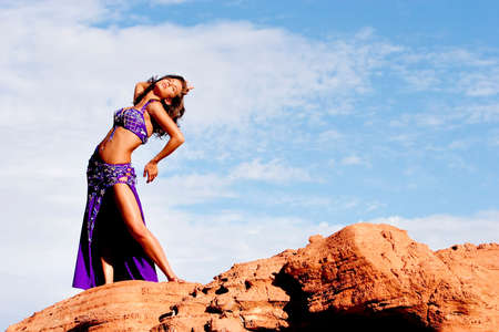 Beautiful sexy bellydancer in the desertの写真素材