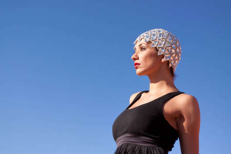 Sexy ethnic girl wearing fashionable outfit outdoorsの写真素材