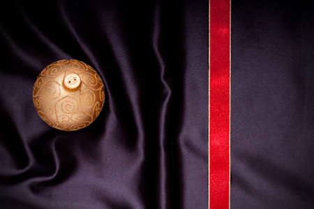 Christmas ornament on black satin material