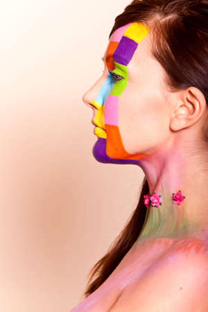Young long hair brunette girl with colorful fashion makeupの写真素材