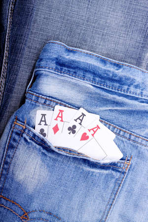 Four of a kind aces in blue jeans pocket