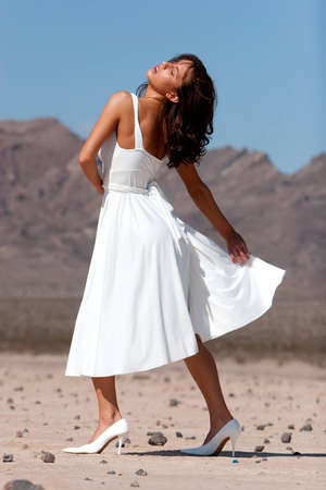 Beautiful woman in dress outdoorsの写真素材