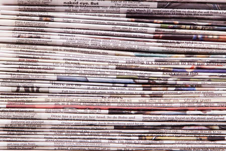 Stacked newspapers background shot in studio