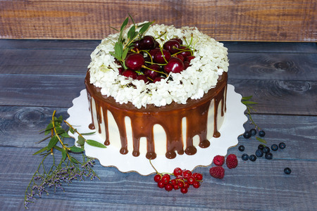 a cake with cherries and hydrangeaの写真素材