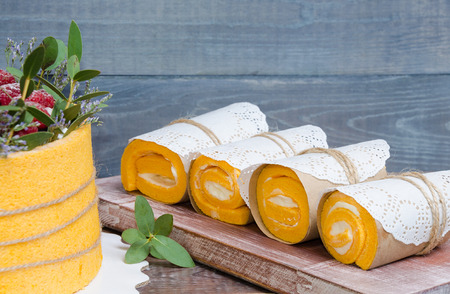 a summer fruit cake rolled in  yellow biscuitの写真素材