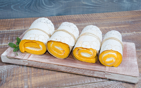 a biscuit roll wraped in a lace napkinの写真素材