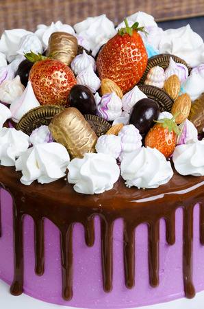 wedding anniversary cake with merengue and chocolate decorationの写真素材