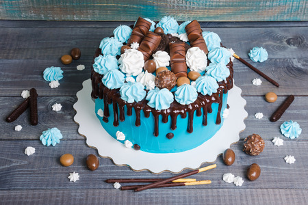 chocolate color drip cream cheese cake with merenguesの写真素材