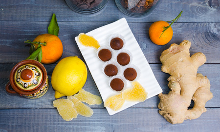 chocolate truffles with ginger candies in a gift boxの写真素材
