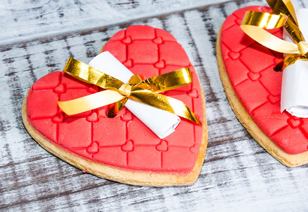 gentle romantic valentine chocolate figures on cookie standの写真素材
