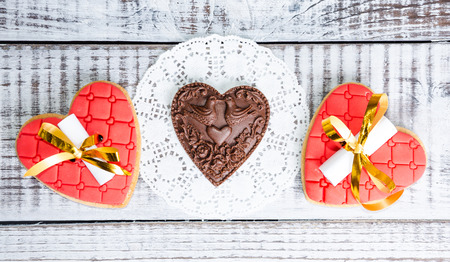 gentle romantic valentine chocolate figures on cookie standの写真素材
