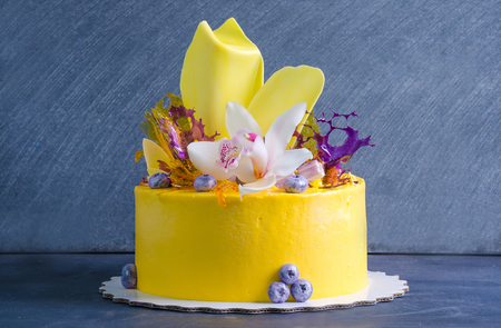 yellow cream cheese cake with chocolate twist and isomalt decorationの写真素材