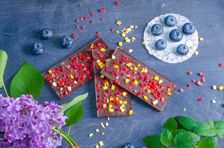 Chocolate bars with dried peach and strawberriesの写真素材
