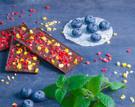 Chocolate bars with dried peach and strawberriesの写真素材