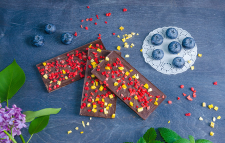 Chocolate bars with dried peach and strawberriesの写真素材