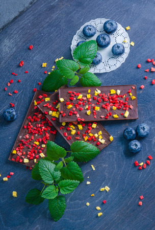Chocolate bars with dried peach and strawberriesの写真素材