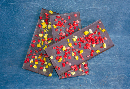 Chocolate bars with dried peach and strawberriesの写真素材