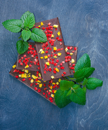 Chocolate bars with dried peach and strawberriesの写真素材