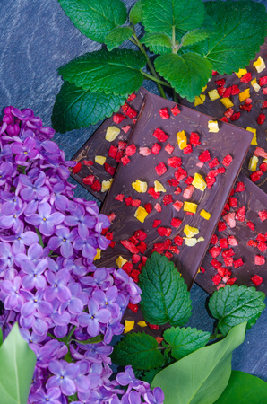 Chocolate bars with dried peach and strawberriesの写真素材