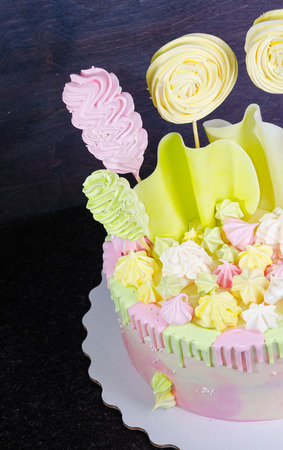 cream cheese cake with chocolate twist and bright merengue decorationの写真素材