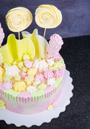 cream cheese cake with chocolate twist and bright merengue decorationの写真素材