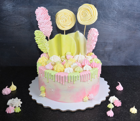 cream cheese cake with chocolate twist and bright merengue decorationの写真素材