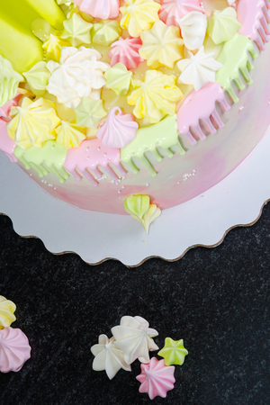 cream cheese cake with chocolate twist and bright merengue decorationの写真素材