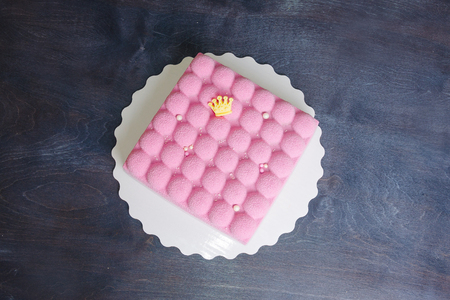 pink chocolate velour mousse cake with pearlsの写真素材