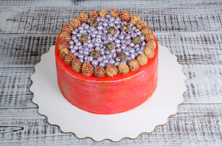 orange cream cheese cake with raspberry, bilberry and  blueberryの写真素材