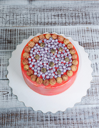 orange cream cheese cake with raspberry, bilberry and  blueberryの写真素材