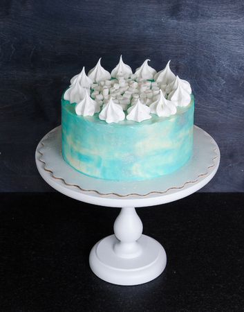 Light blue cream cheese cake with marshmallow and merenguesの写真素材