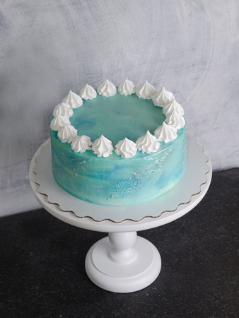 Light blue cream cheese cake with marshmallow and merenguesの写真素材